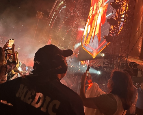 EMT listening to the radio at the Rebelde reunion concert in El Paso, Texas